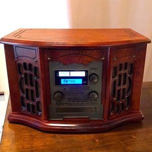 Record Player (Vinyl, CD, Cassette) AM/FM radio w/ additional auxiliary jack